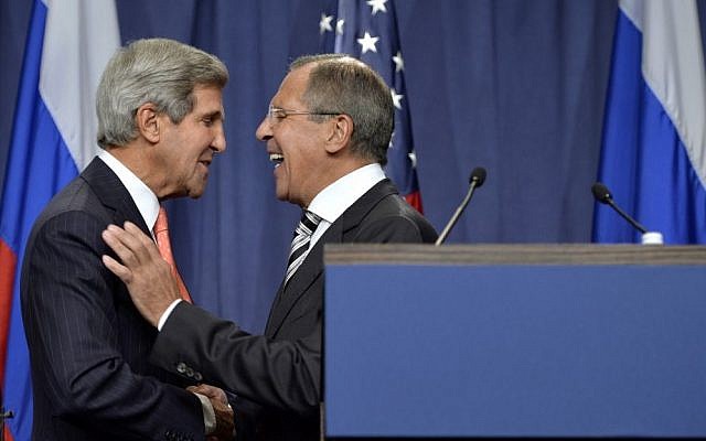 US Secretary of State John Kerry, left, shakes hands with Russian Foreign Minister Sergey Lavrov at a news conference in Geneva, Switzerland, last September (photo credit: AP/Keystone/Martial Trezzini)