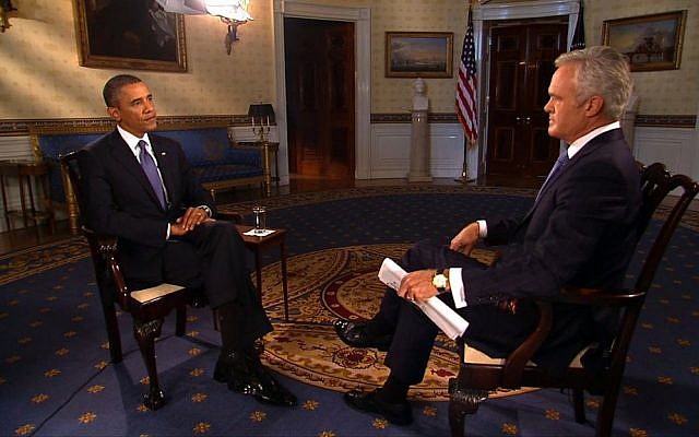 CBS news anchor Scott Pelley, right, interviews US President Barack Obama in the Blue Room of the White House in Washington, on Monday (photo credit: AP/CBS News)