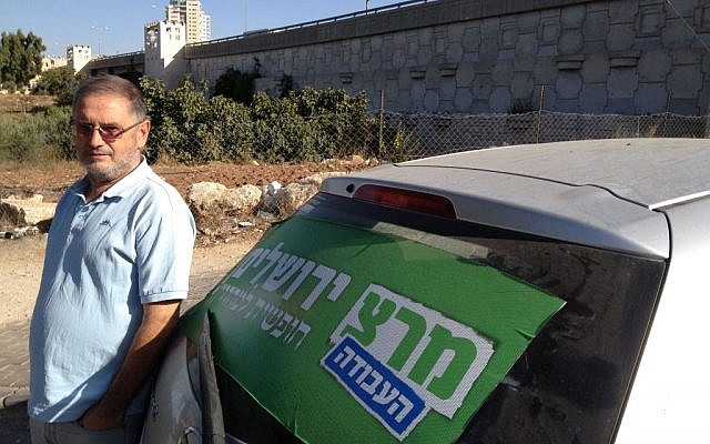 Meretz council member Meir Margalit stands outside the polling center at Beit Safafa, October 22, 2013 (photo credit: Elhanan Miller/Times of Israel)