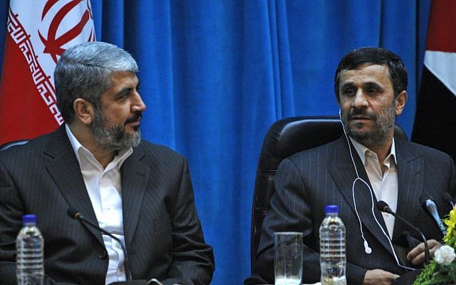 Hamas politburo chief Khaled Mashaal sits next to former Iranian president Mahmoud Ahmadinejad during a conference in Tehran, February 2010 (photo credit: AP/Vahid Salemi)