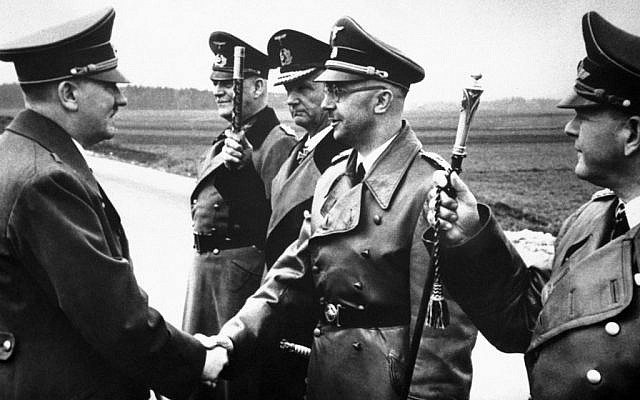Adolf Hitler (left) shakes hands with Heinrich Himmler somewhere in Germany on May 18, 1944. From left to right: Hitler, Minister Field Marshal Wilhelm Keitel, Admiral Karl Doenitz, Himmler and Field Marshal General Erhard Milch. (AP)