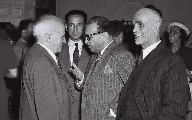 Iranian Minister Plenipotentiary Reza Safinia, center, who represented Tehran in Israel, chats with then-prime minister David Ben-Gurion at a party in Jerusalem, June 1, 1950 (photo credit: Teddy Brauner/GPO)