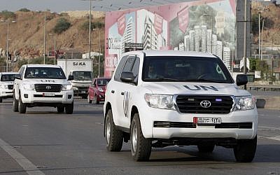 The convoy of a UN team of weapons inspectors, who concluded its almost week-long mission in Syria, arrive at Rafik Hariri international airport in Beirut, Lebanon, Monday, September. 30, 2013. (photo credit: AP Photo/Bilal Hussein)