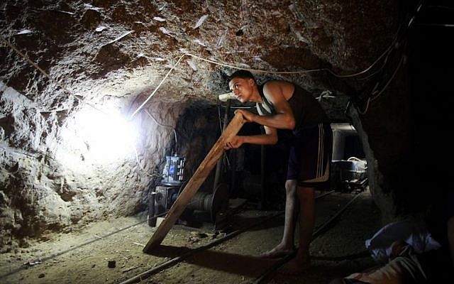 Illustrative: Working in a smuggling tunnel between Gaza and Egypt (photo credit: Hatem Moussa/AP)