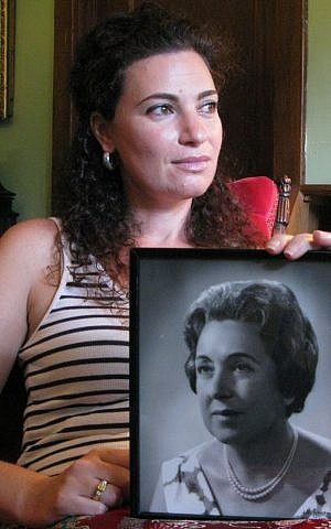 'The Pin' director Naomi Jaye holding a photo of her grandmother, Leah Jaye, who had asked that she be pricked with a pin upon her death. (photo credit: Ronit Novak/Courtesy of Naomi Jaye)