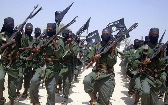 Al-Shabaab fighters march with their weapons during military exercises on the outskirts of Mogadishu, Somalia, in 2011. (AP/Mohamed Sheikh Nor)