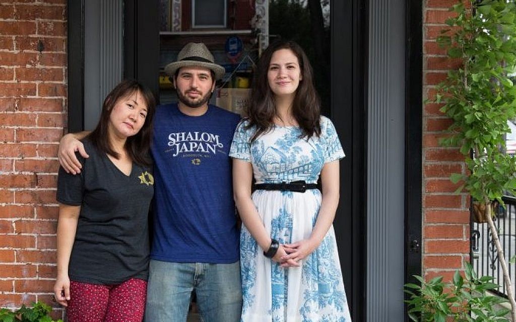 From left: married chefs Sawako Okochi and Aaron Israel, with manager Micaela Grossman, in front of Brooklyn's Shalom Japan. (photo credit: courtesy)