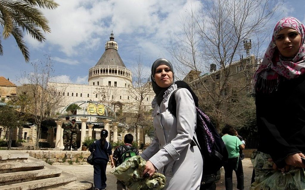 Muslim women pass by the Basilica of the Annunciation in Nazareth, March 2011 (photo credit: Natti Shohat/Flash90)