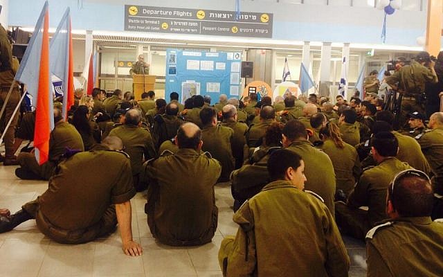 IDF soldiers at Ben Gurion airport before the departure of their flight to Thailand, where they were set to erect o field hospital for victims of a devastating typhoon, Wednesday, November 13, 2013 (photo credit: IDF spokesperson, Twitter)
