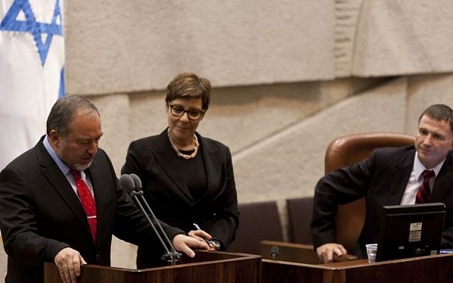 Avigdor Liberman takes his oath of office in front at the Knesset on November 11, 2013. The 120-member House confirmed by a vote of 62 to 17 his reappointment as foreign minister (Photo credit: Flash90)