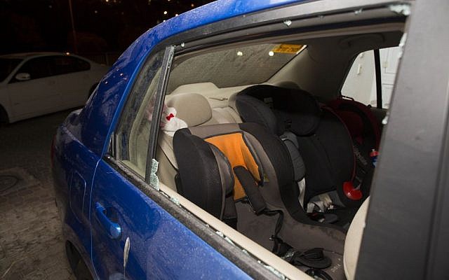 The car in which Avigail Ben Zion, 2, was injured by a stone near her home in Armon Hanatziv, Jerusalem, November 28, 2013. (Photo credit: Yonatan Sindel/Flash90)