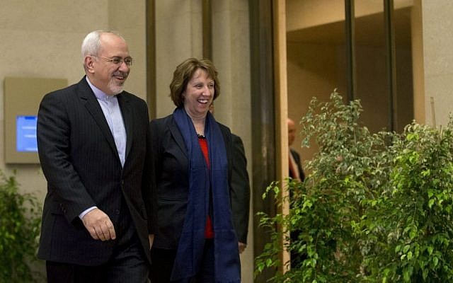 EU High Representative for Foreign Affairs Catherine Ashton, right, and Iranian Foreign Minister Mohammad Javad Zarif, arrive for a photo opportunity prior to the start of closed-door nuclear talks in Geneva, Switzerland, Wednesday, Nov. 20, 2013 (photo credit: AP/Keystone,Salvatore Di Nolfi)