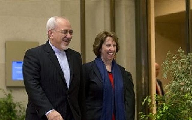 EU High Representative for Foreign Affairs Catherine Ashton, right, and Iranian Foreign Minister Mohammad Javad Zarif, arrive for a photo opportunity prior to the start of three days of closed-door nuclear talks in Geneva, Switzerland, Wednesday, Nov. 20, 2013 (photo credit: AP/Keystone,Salvatore Di Nolfi)