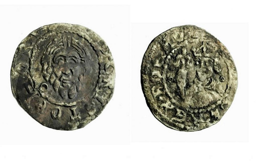 A 13th century silver penny found in Acre, the oldest coin mentioning the king of Bohemia (reverse at left, obverse at right). (photo credit: Clara Amit, IAA Photography Department)