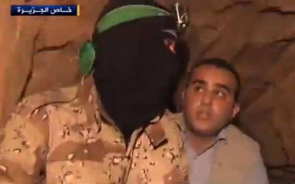A Hamas operative taking an Al Jazeera reporter on a tour of a tunnel. (Screenshot: Al Jazeera)