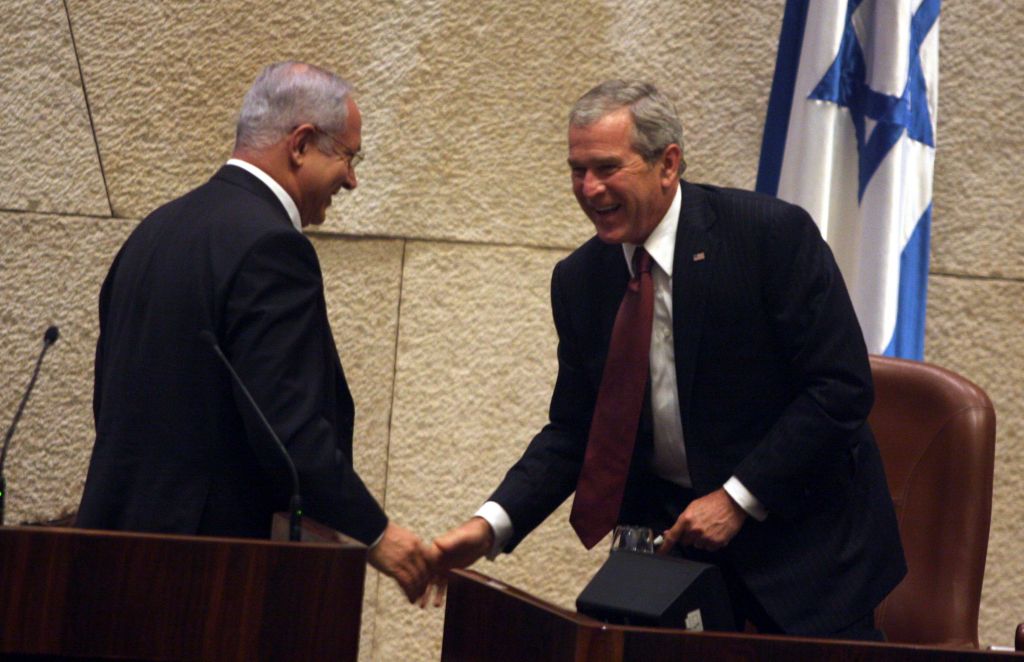 US president George W. Bush shake hands with Benjamin Netanyahu, head of the opposition, at the Knesset on May 15, 2008. Bush delivered a speech to mark the Jewish state's 60th birthday. (Photo credit: Lior Mizrahi/pool/FLASH90)