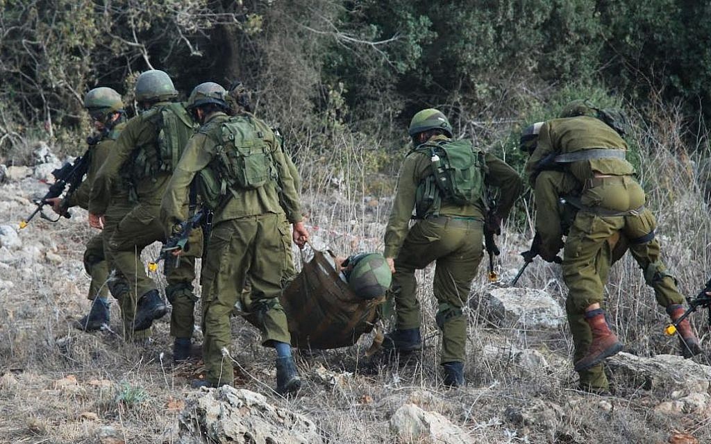 IDF troops practicing the evacuation of a wounded soldier on a sling-like stretcher (photo credit: IDF Spokesperson's Unit)