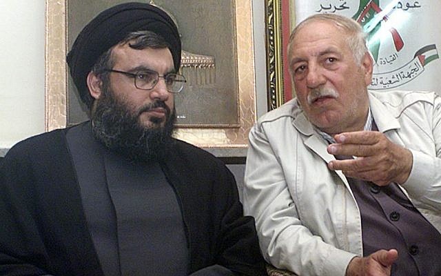PFLP-GC chief Ahmed Jibril (right) pictured with Hezbollah leader Hassan Nasrallah in Beirut in May 2002. (photo credit: AP Photo/Bassem Tellawi)
