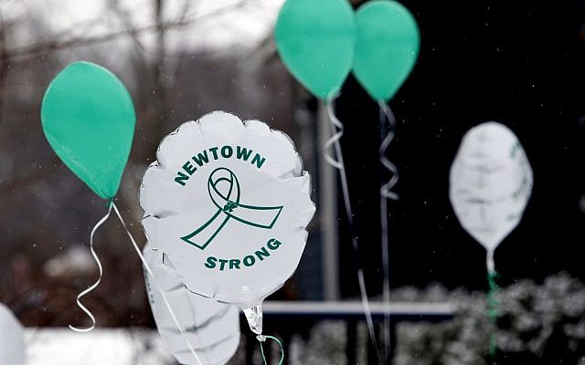 Balloons fly on the first anniversary of the Sandy Hook massacre, in Newtown, Connecticut, on Saturday, December 14, 2013. (AP/Robert F. Bukaty)