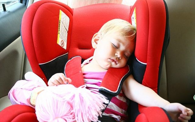 Illustrative photo of a baby sleeping in a car seat (photo credit: Chen Leopold/Flash90)