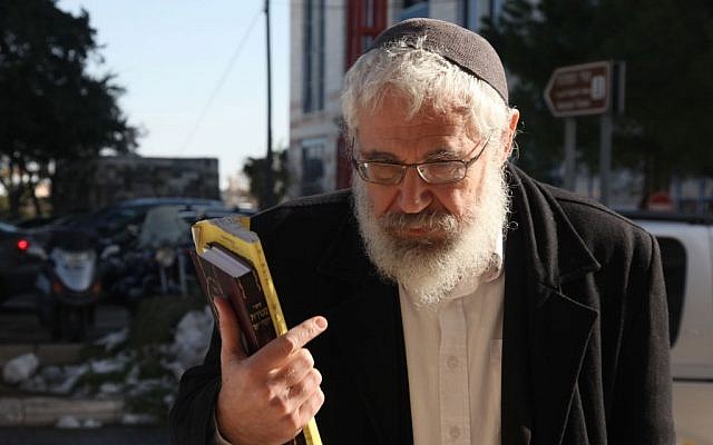 Rabbi Mordechai Elon arrives at the Jerusalem Magistrate's Court to hear his sentence, December 18, 2013. (photo credit: Meital Cohen/Flash90)