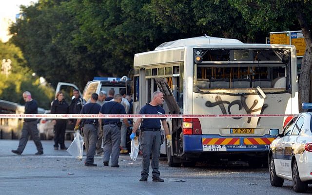 Police and rescue personnel at the scene of an explosion on a Bat Yam passenger bus on Sunday, December 22, 2013. (photo credit: Yossi Zeliger/Flash90)