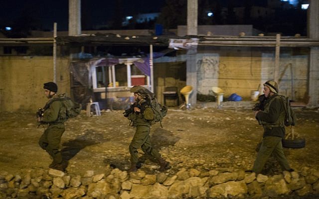 IDF soldiers on patrol near where a police officer was stabbed Monday (photo credit: Yonatan Sindel/ lash90)