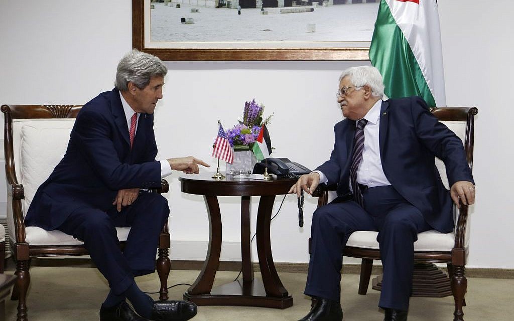 US Secretary of State John Kerry, left, meets Palestinian President Mahmoud Abbas in the West Bank city of Ramallah on Thursday, December 5, 2013.  (photo caption: AP/Mohamad Torokman, Pool)