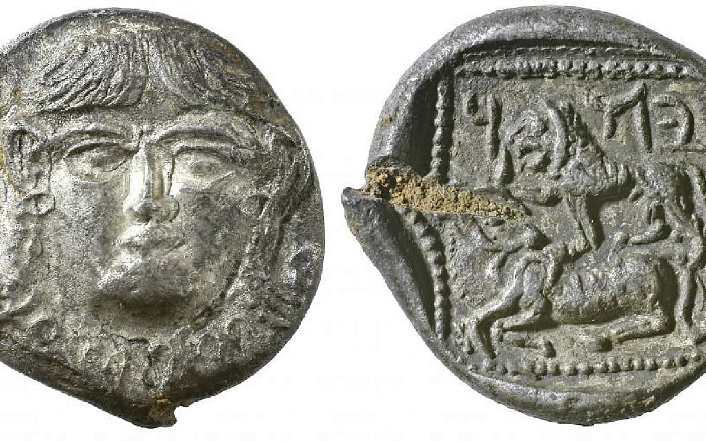 A 5th century silver drachm from Persian era Palestine with a gorgoneion on the obverse (left) and a lion and bovine on the reverse (right). Above the lion are the Aramaic letters yod, heh and dalet -- Judea. (photo credit: Vladimir Naikhin/The Israel Museum)