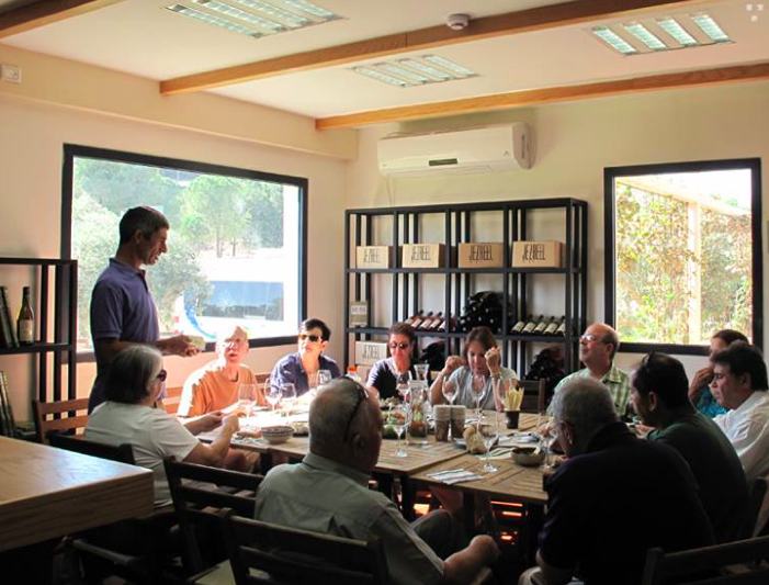 Serial entrepreneur Jacob Ner-David speaking to a group of visitors at the Jezreel Winery (Courtesy Jezreel Winery)