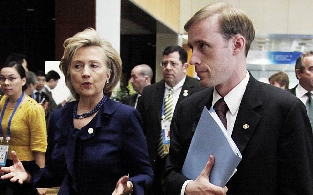 This Nov. 11, 2009 file photo shows then-Secretary of State Hillary Rodham Clinton walking with then-Deputy Chief of Staff Jake Sullivan in Singapore. (AP Photo/Ng Han Guan, File)
