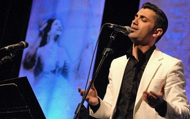 Singer Ziv Yehezkel performing with the Ashkelon Andalusian-Meditteranean Orchestra in Jerusalem, December 2013. (photo credit: Yoram Blumenkrantz)