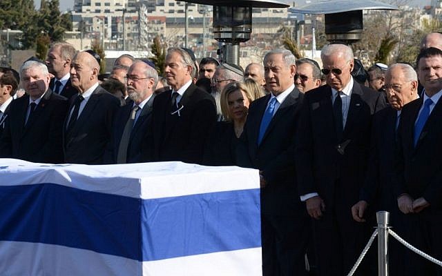 Israeli and world leaders stand in front of Ariel Sharons flag-draped casket, during a ceremony in honor of the former prime minister in front of the Knesset in Jerusalem, Monday, January 13, 2014 (photo credit: Amos Ben Gershom/GPO/Flash90)