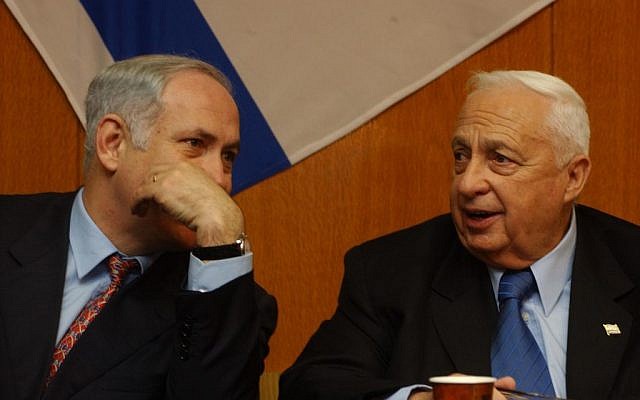 Benjamin Netanyahu speaks with Ariel Sharon in 2003. (photo credit: Flash 90)