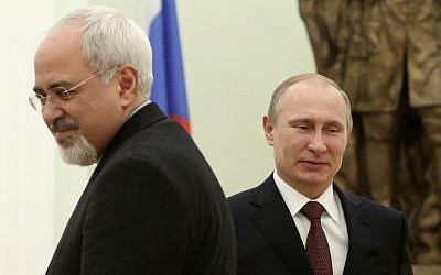 Russian President Vladimir Putin and Iranian Foreign Minister Mohammad Javad Zarif during a meeting in the Kremlin in Moscow, Russia, on January 16, 2014. (photo credit: AP/Sergei Karpukhin, Pool)