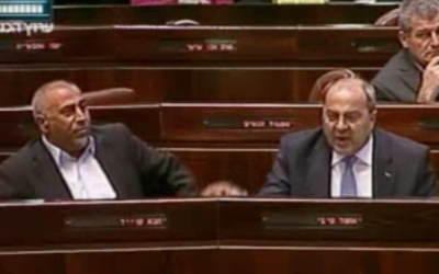 Taleb Abu Arar (left) and Ahmad Tibi heckle Prime Minister Benjamin Netanyahu during a special Knesset session addressed by Canadian Prime Minister Stephen Harper on Tuesday (photo credit: Channel 2 screenshot)