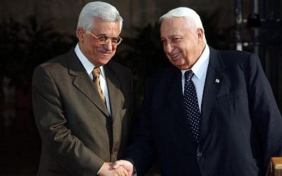 Ariel Sharon with Mahmoud Abbas at the Prime Minister's Office on July 01, 2003. (Photo credit: Nati Shohat Flash90)