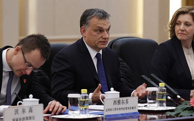 Hungarian Prime Minister Viktor Orban (center) during a trip to China on February 13, 2014. (photo credit: AFP/ROLEX DELA PENA