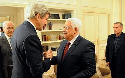John Kerry, left, with Mahmoud Abbas in Paris, France, on February 19, 2014. (photo credit: US State Department)