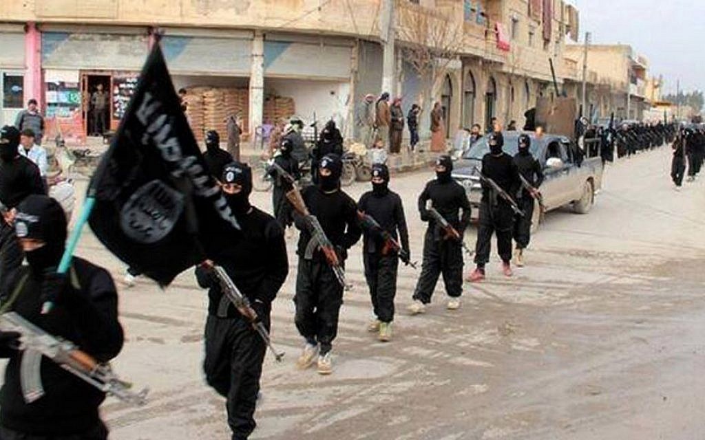 This undated file image posted on a militant website on Tuesday, Jan. 14, 2014, shows fighters from the al-Qaeda linked Islamic State of Iraq and the Levant (ISIS) marching in Syria (photo credit: AP)