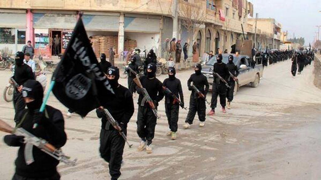This undated file image posted on a militant website on Tuesday, Jan. 14, 2014, shows fighters from the al-Qaeda linked Islamic State of Iraq and the Levant (ISIS) marching in Syria (photo credit: AP)