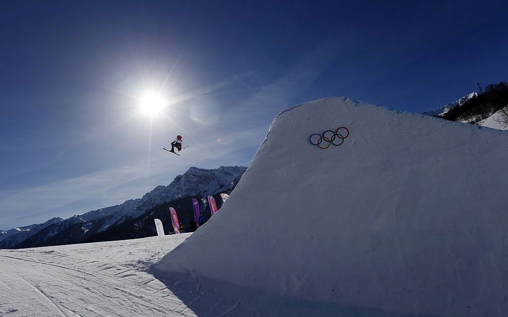 Britain's James Woods takes a jump during ski slopestyle training at the Rosa Khutor Extreme Park ahead of the 2014 Winter Olympics, Friday, Feb. 7, 2014, in Krasnaya Polyana, Russia. (photo credit: AP Photo/Sergei Grits)