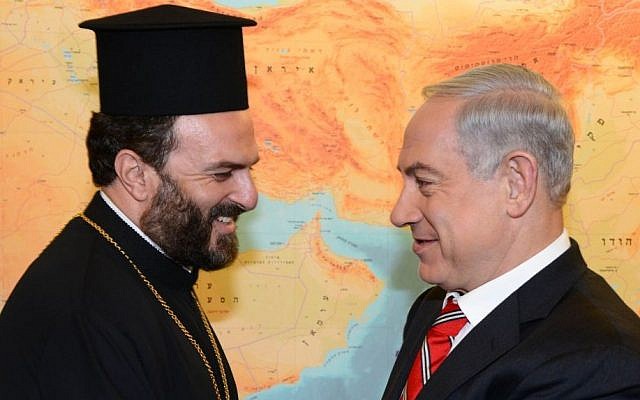 Prime Minister Benjamin Netanyahu meets Father Gabriel Nadaf in his Jerusalem office, August 5, 2013 (photo credit: Moshe Milner/Flash90/GPO)