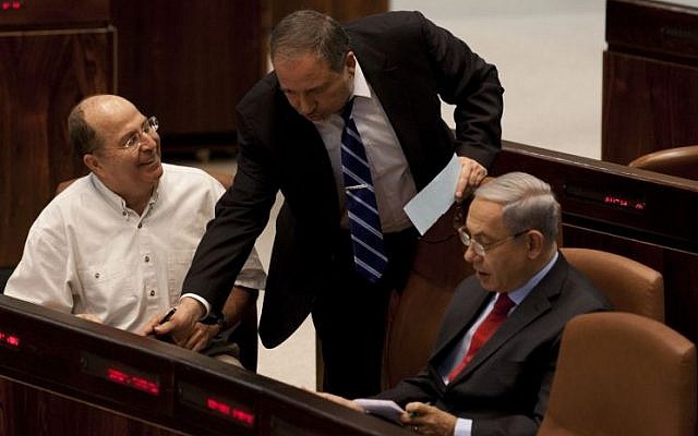 Prime minister Benjamin Netanyahu (R), Defense Minister Moshe Ya'alon (L) and Foreign Minister Avigdor Liberman in the Knesset, November 13, 2013. (Photo credit: Flash 90)