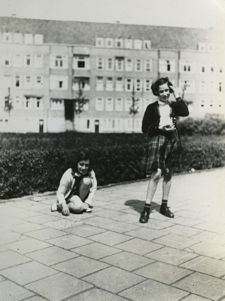 Anne Frank (L) plays with her friend Hanneli Goslar (R) on the Merwedeplein square in Amsterdam, May 1941 (photo credit: AP Photo/Anne Frank House Amsterdam/Anne Frank Fonds Basel photo collections)