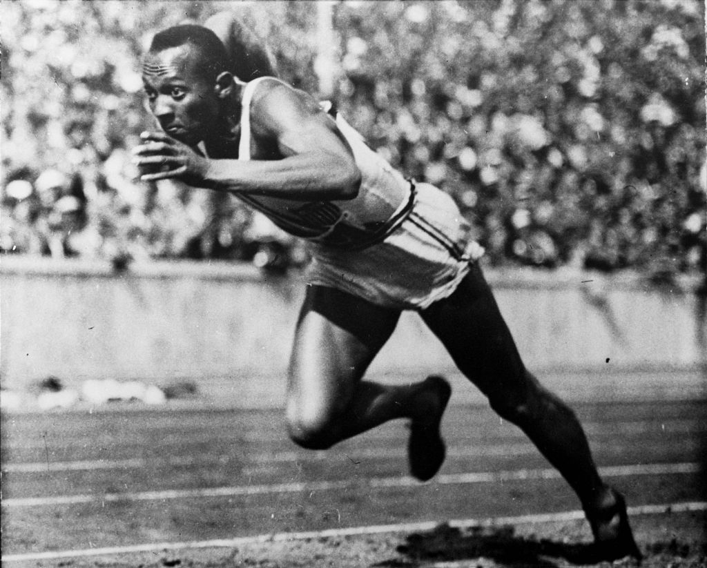 In this 1936 file photo, Jesse Owens of the United States runs in a 200-meter preliminary heat at the 1936 Summer Olympics in Berlin. Owens won four gold medals at the 1936 Berlin Olympics and showed up Adolph Hitler's idea of Aryan supremacy.  (photo credit: AP Photo/File)