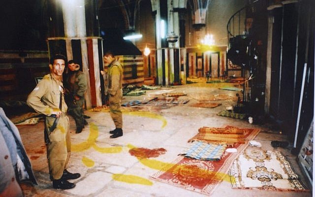 Israeli soldiers stand next to blood stains on the floor of Yitzhak Hall in the Tomb of the Patriarchs following the Goldstein massacre, February 25, 1994. (photo credit: Flash90)