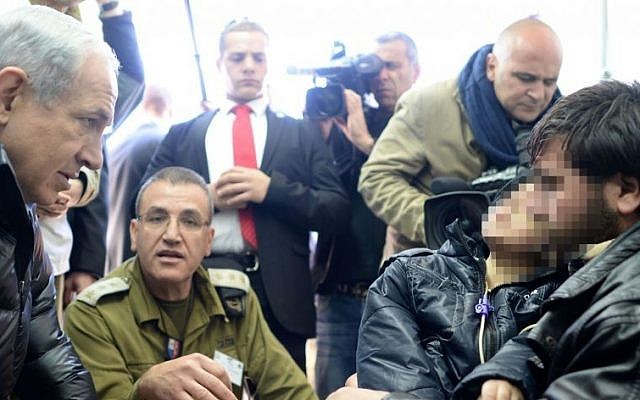 Prime Minister Benjamin Netanyahu visits an IDF field hospital for treatment of wounded from the civil war in Syria, in Ramat ha Golan, Northern Israel. February 18, 2014. (photo credit: Kobi Gideon /GPO/FLASH90)
