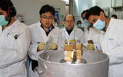 Illustrative: International Atomic Energy Agency inspectors (2nd and 3rd left) and Iranian technicians at the Natanz nuclear power plant, south of Tehran, on January 20, 2014. (Kazem Ghane/IRNA/AFP/File)