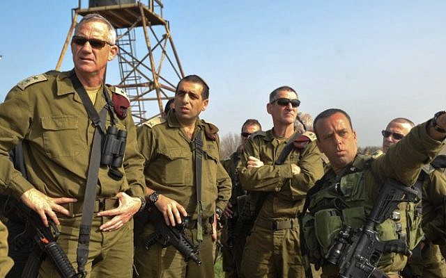 IDF Chief of Staff Benny Gantz (L) seen during a tour in the Golan Heights, February 23, 2014 (photo credit: IDF Spokesperson/Flash90)